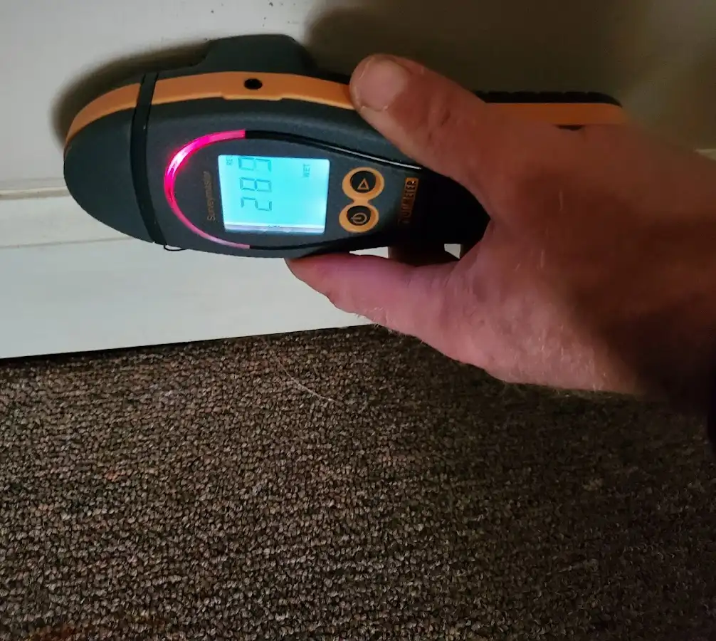 Moisture detection at baseboard during Storm Damage Restoration in Scotts Valley